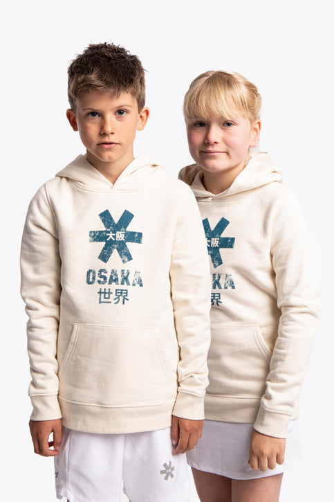 Boy and girl wearing the Osaka kids vintage hoodie in natural raw with logo in blue. Front view