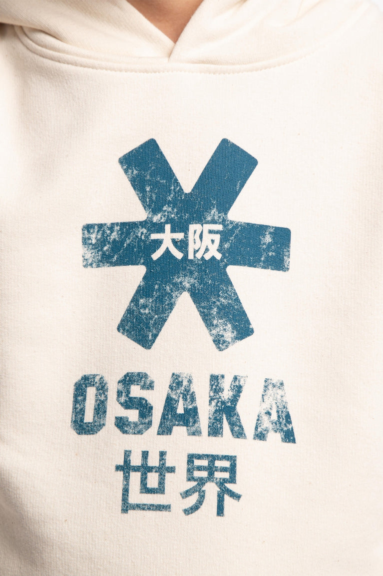 Osaka kids vintage hoodie in natural raw with logo in blue. Detail view logo