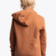 Girl wearing the Osaka kids vintage hoodie in caramel with logo in white. Back view