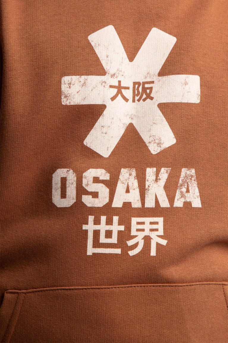 Osaka kids vintage hoodie in caramel with logo in white. Detail view logo