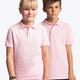 Boy and girl wearing the Osaka kids polo in cotton pink with logo in white. Front view