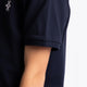 Osaka kids polo in navy with logo in white. Detail view sleeve