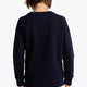 Boy wearing the Osaka kids sweater in navy with logo in blue. Back view