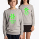 Boy and girl wearing the Osaka kids sweater in grey with logo in green. Front view