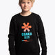 Girl wearing the Osaka kids pixo sweater in black with orange and blue logo. Front view