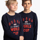 Boy and girl wearing the Osaka kids worldcup sweater in navy with orange logo. Front view