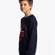 Boy wearing the Osaka kids worldcup sweater in navy with orange logo. Side/front view