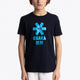 Boy wearing the Osaka kids tee short sleeve navy with logo in blue. Front view