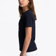 Girl wearing the Osaka kids tee short sleeve navy with logo in blue. Side view