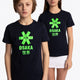 Boy and girl wearing the Osaka kids tee short sleeve navy with logo in green. Front view