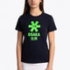 Girl wearing the Osaka kids tee short sleeve navy with logo in green. Front view