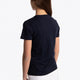 Girl wearing the Osaka kids tee short sleeve navy with logo in green. Back view