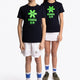Boy and girl wearing the Osaka kids tee short sleeve navy with logo in green. Front full view
