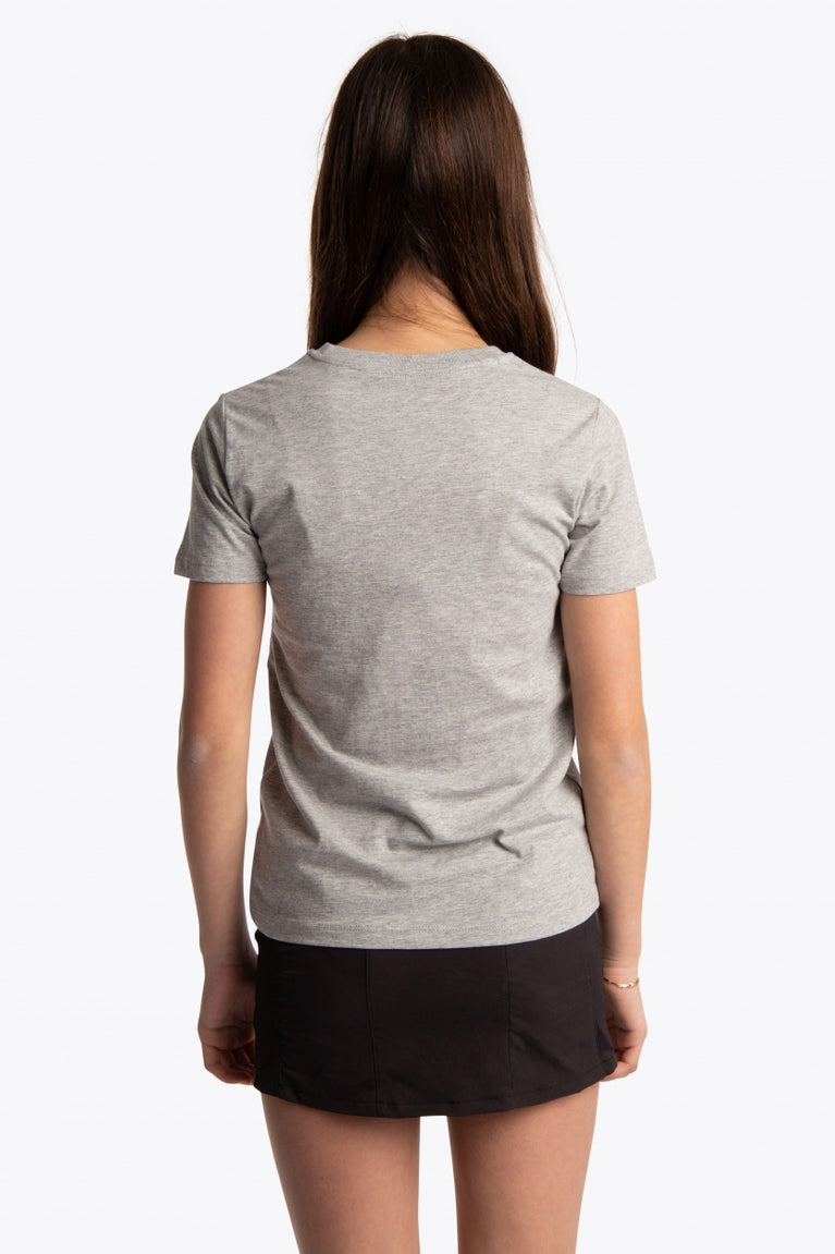 Girl wearing the Osaka kids tee short sleeve grey with logo in green. Back view