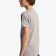 Boy wearing the Osaka kids tee short sleeve grey with logo in green. Side view