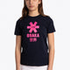 Girl wearing the Osaka kids tee short sleeve navy with logo in pink. Front view