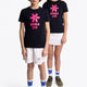 Boy and girl wearing the Osaka kids tee short sleeve navy with logo in pink. Front full view