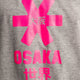 Osaka kids tee short sleeve grey with logo in pink. Detail view logo