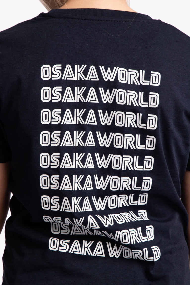 Boy wearing the Osaka kids service games tee short sleeve navy with logo in white. Back view