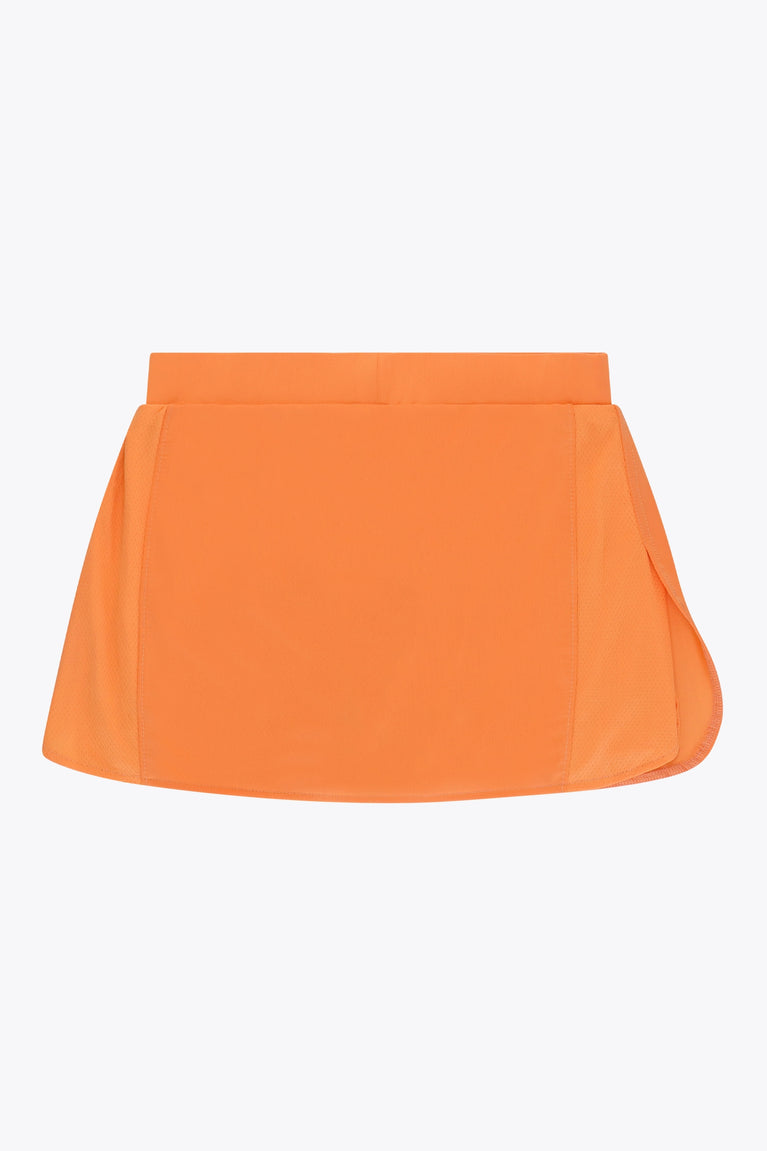 Osaka women ball skort in orange with logo in white. Back flatlay view