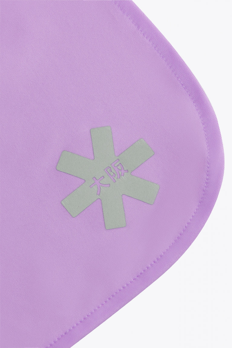 Osaka women ball skort in light purple with logo in grey. Detail logo view