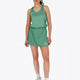 Woman wearing the Osaka women ball skort in green with logo in grey. Front view
