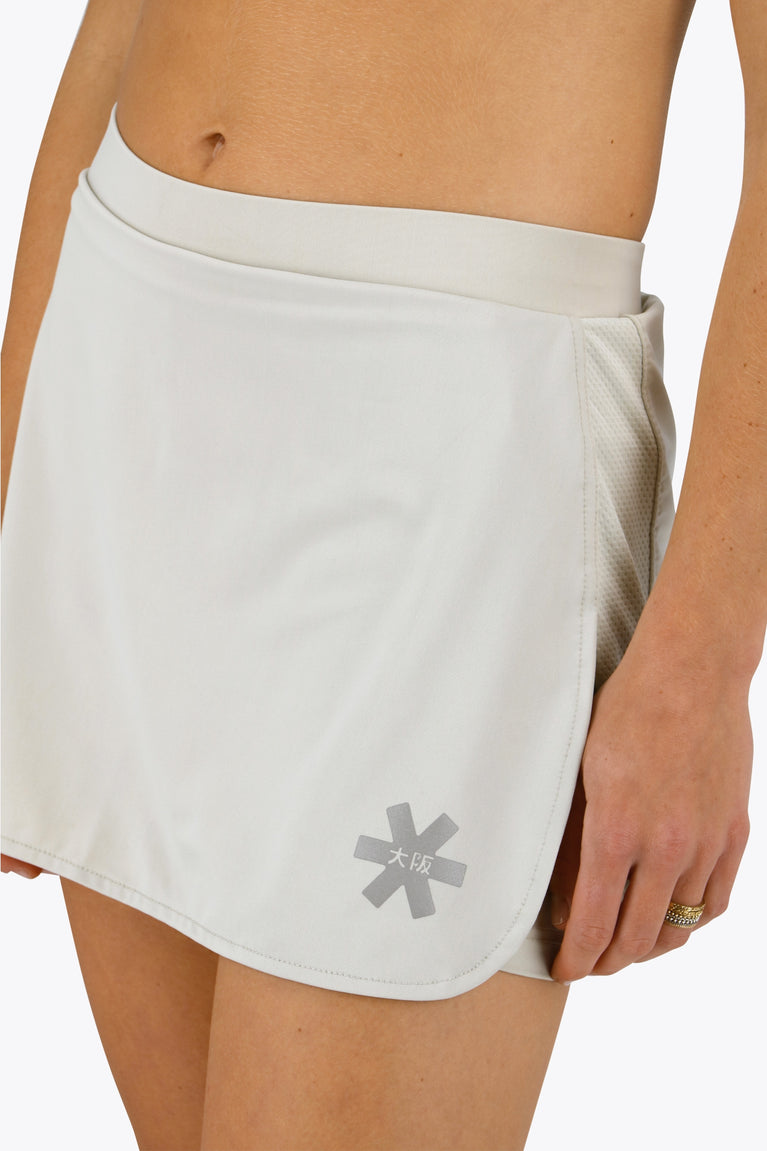 Osaka women ball skort in light grey with logo in grey. Front view