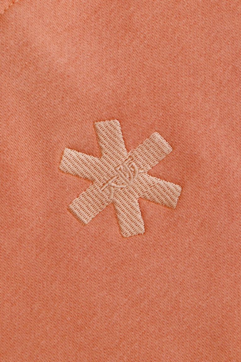 Osaka women half zip sweater in peach with white logo. Detail back logo view