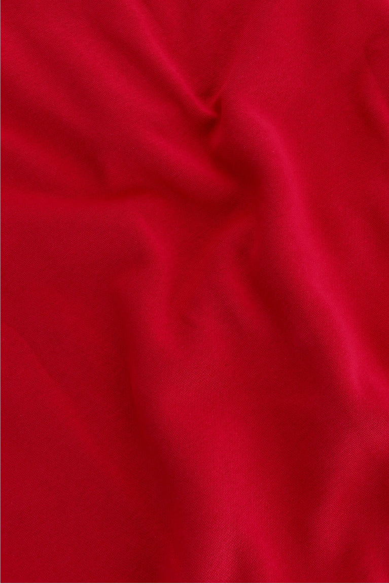 Osaka women half zip sweater in red with white logo. Detail fabric view
