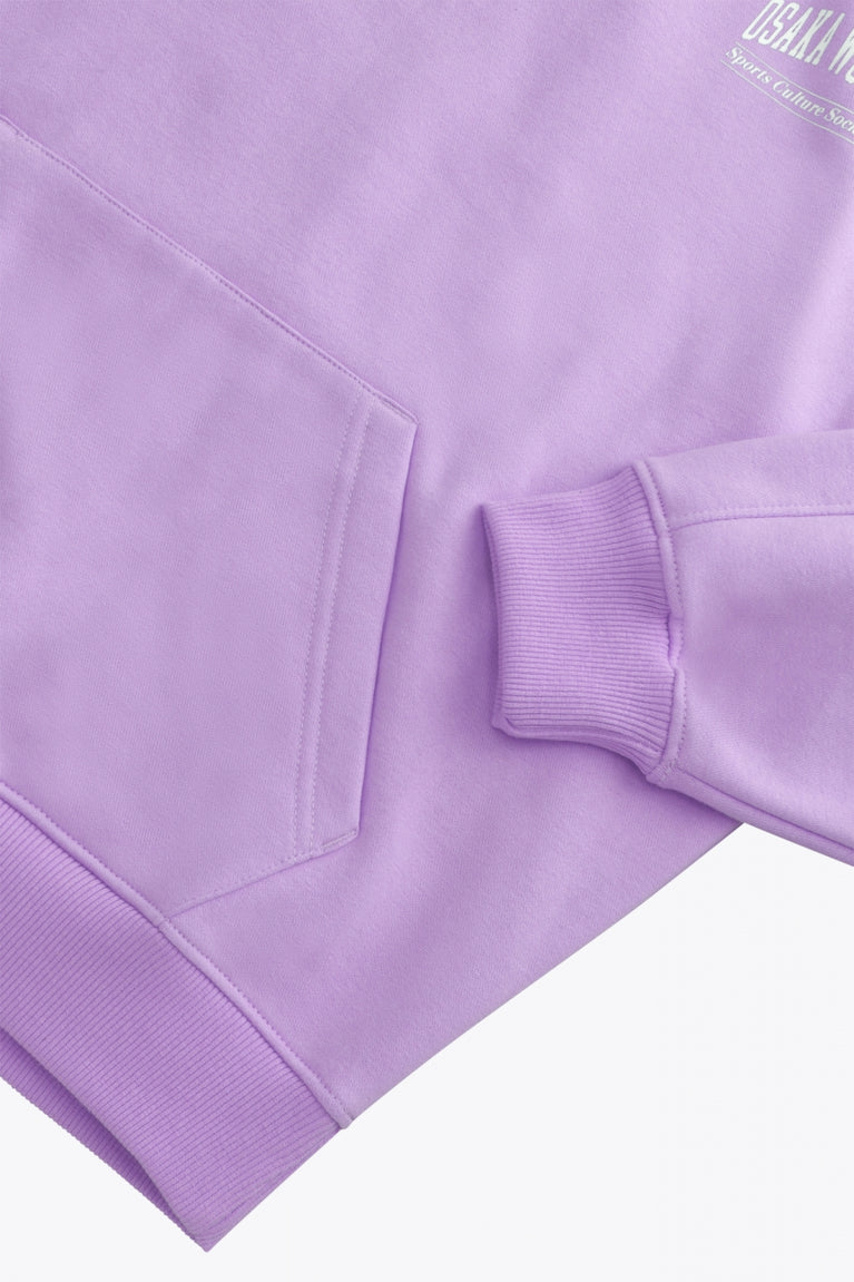 Osaka women half zip sweater in light purple with white logo. Front detail flatlay sleeve view