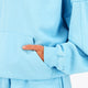 Osaka women half zip sweater in light blue with white logo. Front detail sleeve view
