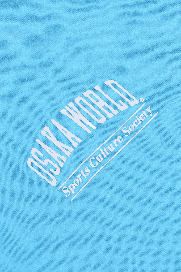 Osaka women half zip sweater in light blue with white logo. Detail logo view