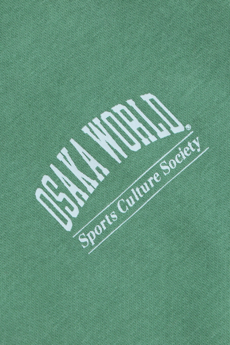 Osaka women half zip sweater green. Detail logo view