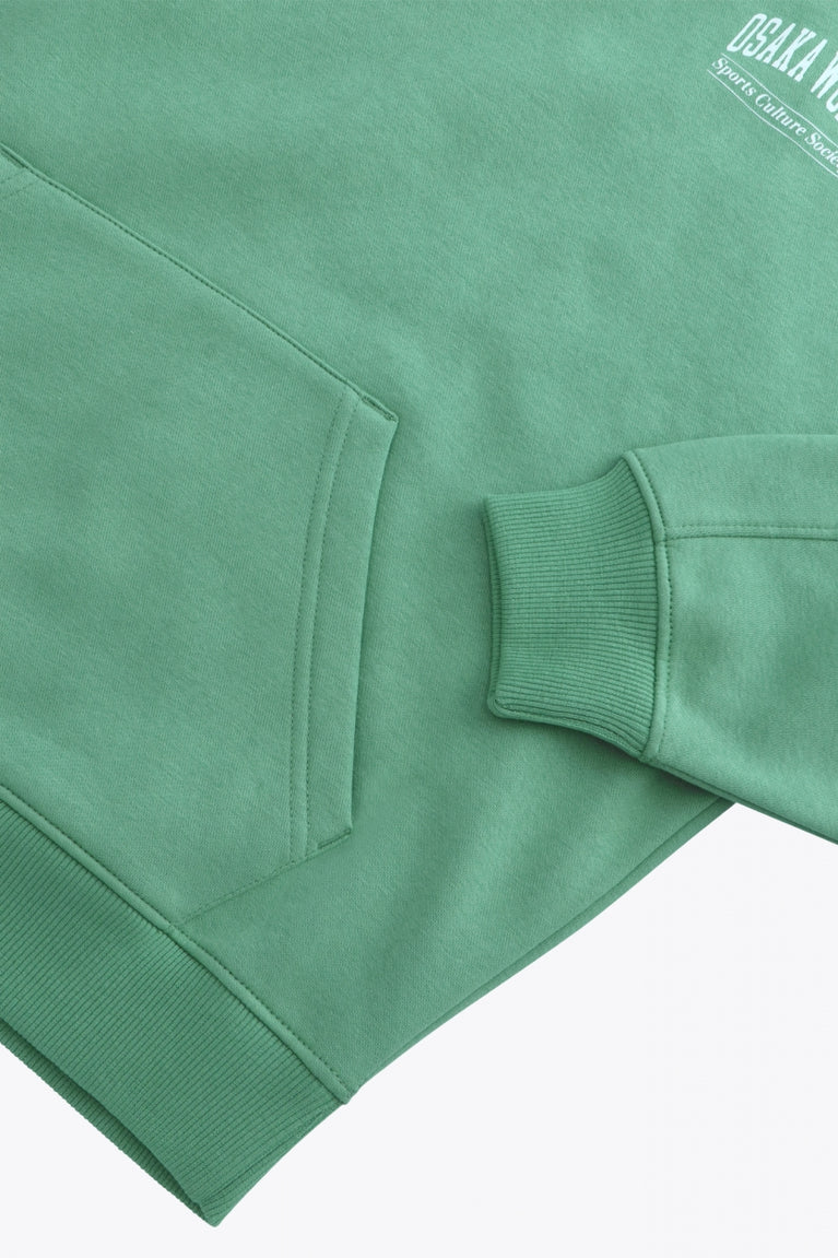 Osaka women half zip sweater green. Front detail flatlay sleeve view