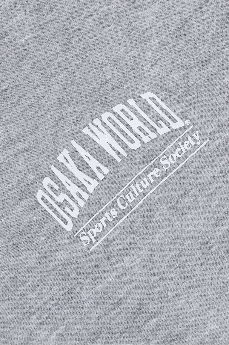 Osaka women half zip sweater in heather grey with white logo. Detail logo view