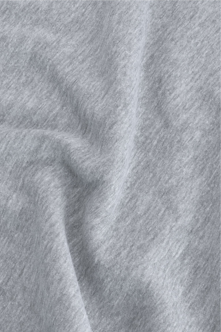 Osaka women half zip sweater in heather grey with white logo. Detail fabric view