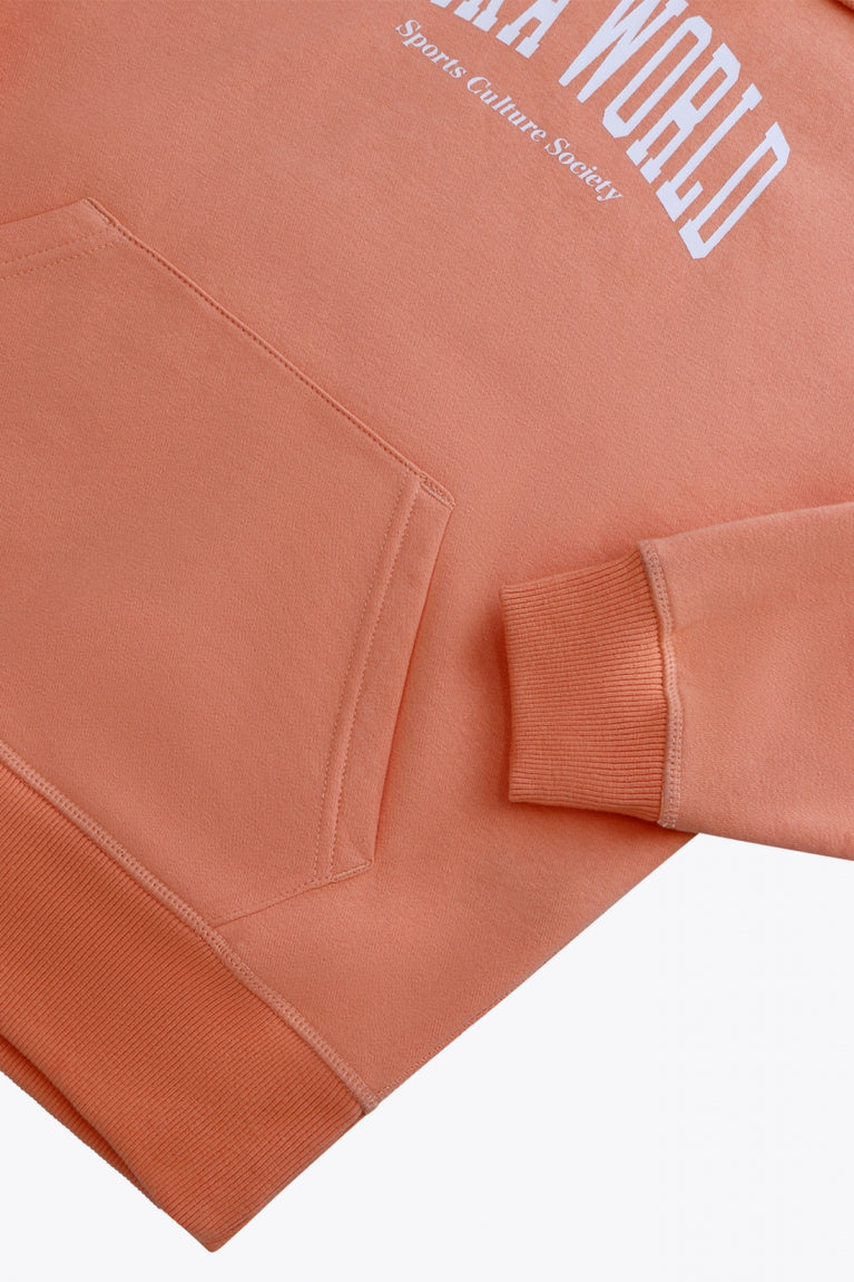 Osaka women hoodie in peach with white logo. Front detail sleeve view