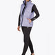 Woman wearing the Osaka women padded gilet in purple with grey logo. Front view