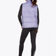 Woman wearing the Osaka women padded gilet in purple with grey logo. Back view