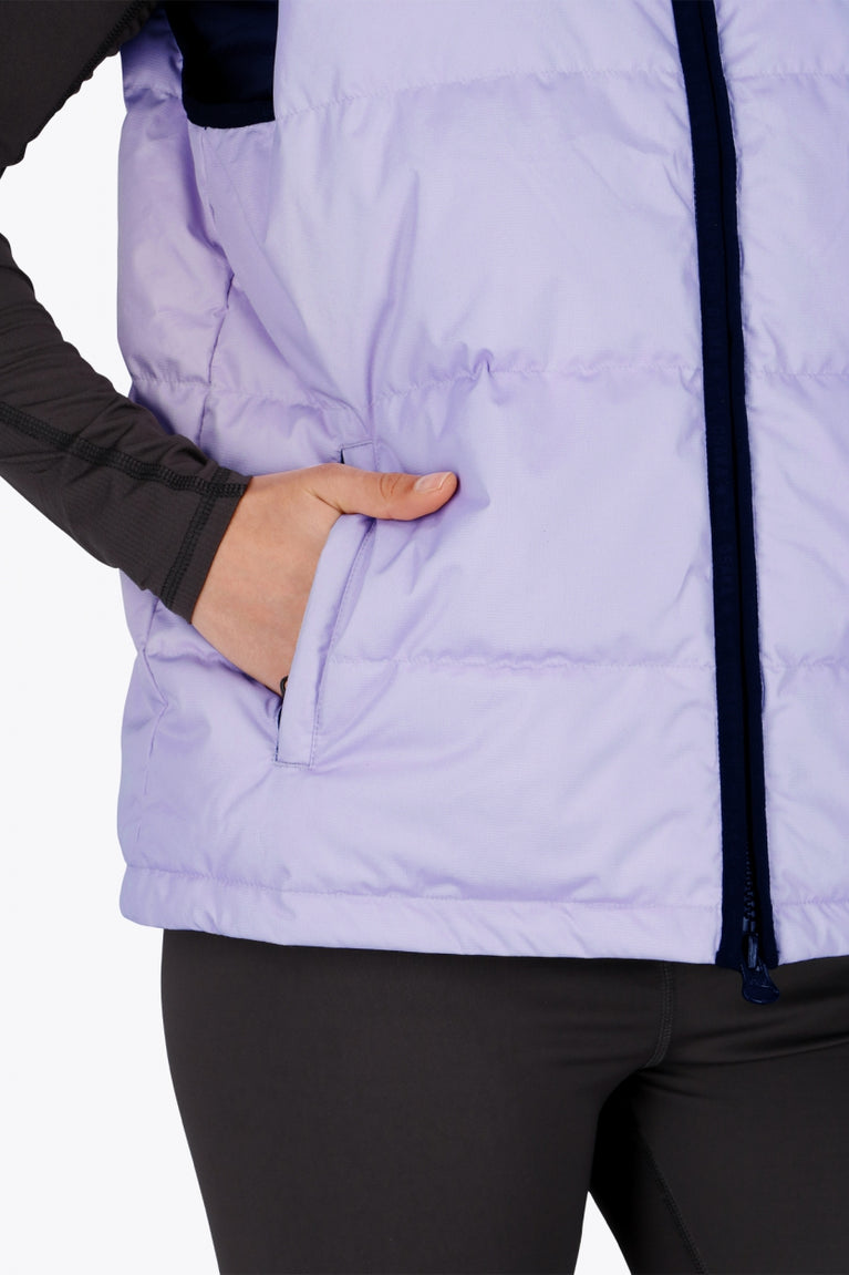 Osaka women padded gilet in purple with grey logo. Front detail pocket view