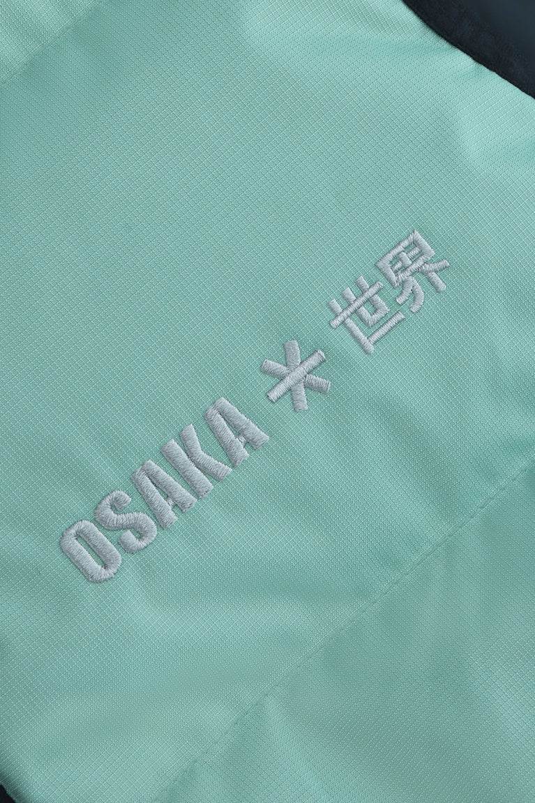 Osaka women padded gilet in green with grey logo. Detail logo view