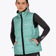 Woman wearing the Osaka women padded gilet in green with grey logo. Front view