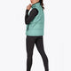 Woman wearing the Osaka women padded gilet in green with grey logo. Back view
