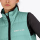 Woman wearing the Osaka women padded gilet in green with grey logo. Front detail logo view
