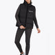 Woman wearing the Osaka women padded gilet in black with white logo. Front view