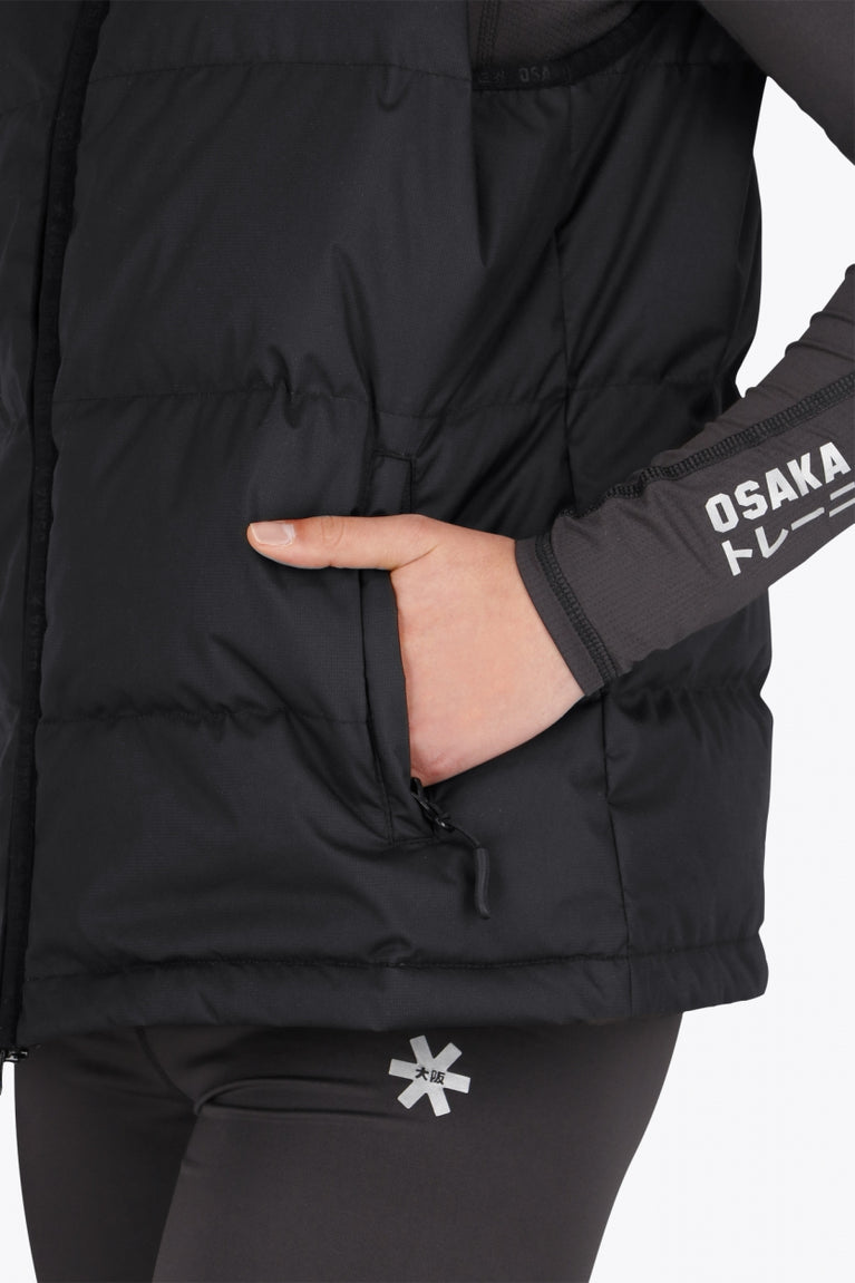 Osaka women padded gilet in black with white logo. Front detail sleeve view