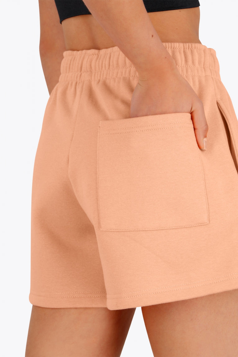 Osaka women shorts in peach with logo in white. Back detail pocket view