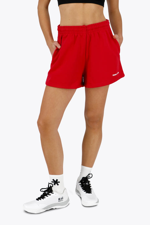 Osaka women shorts in red with logo in white. Front flatlay view