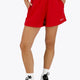 Osaka women shorts in red with logo in white. Front view