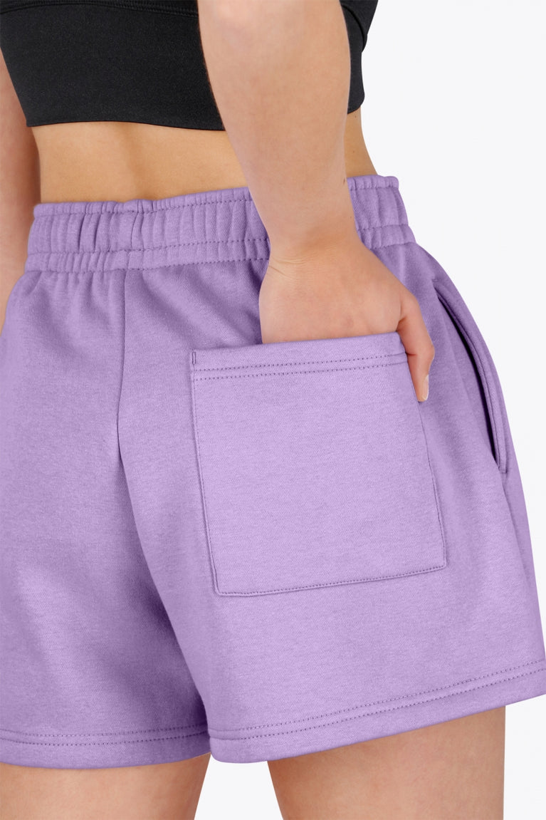 Osaka women shorts in light purple with logo in white. Back detail pocket view